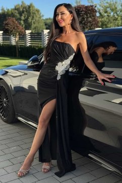 Black evening dress with glitter appliqué and slit