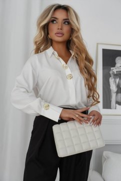 Luxurious blouse with decorative buttons